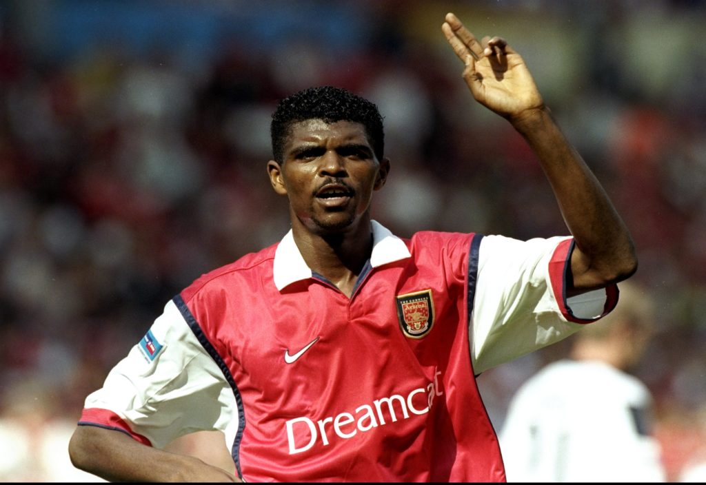 Nwankwo Kanu celebrtates after scoring for Arsenal