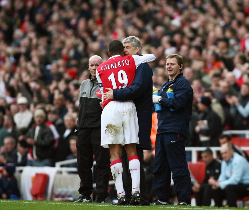 Arsenal's Captain Gilberto Silva (C) hug