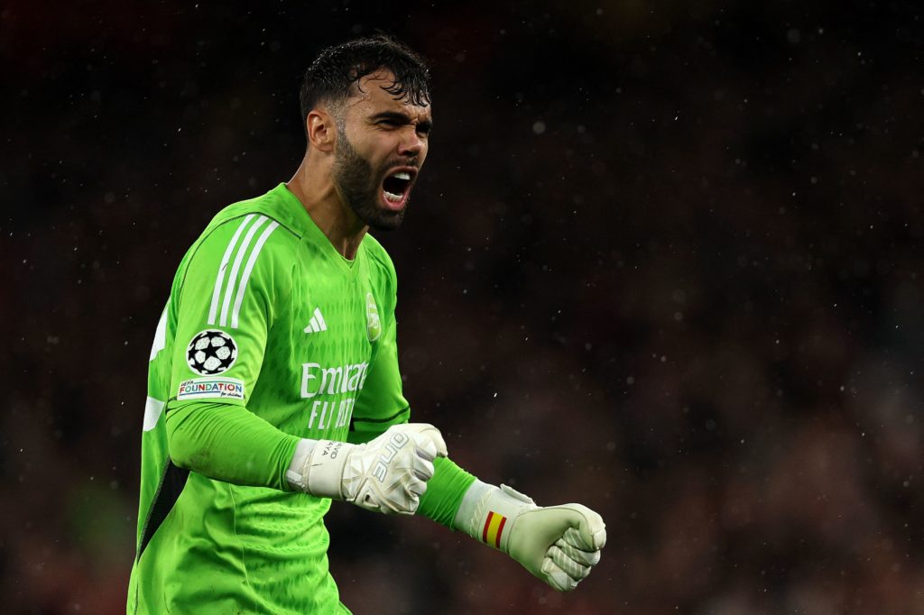 Arsenal goalkeeper David Raya celebrates on Champions League debut vs PSV with Aaron Ramsdale on the bench