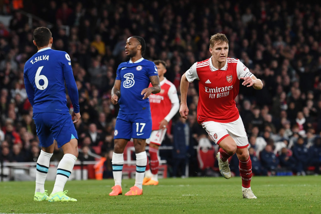 Arsenal captain Martin Odegaard celebrates scoring v Chelsea in Premier League as Raheem Sterling looks on
