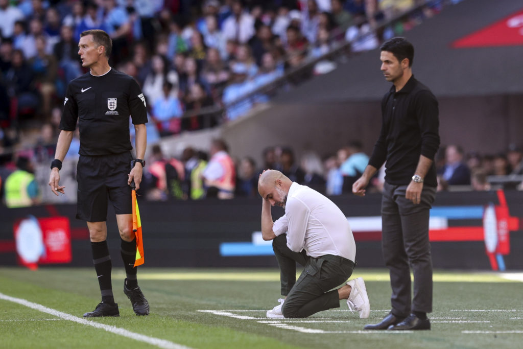 Manchester City manager Pep Guardiola and Arsenal boss Mikel Arteta react during The FA Community Shield ahead of Premier League clash