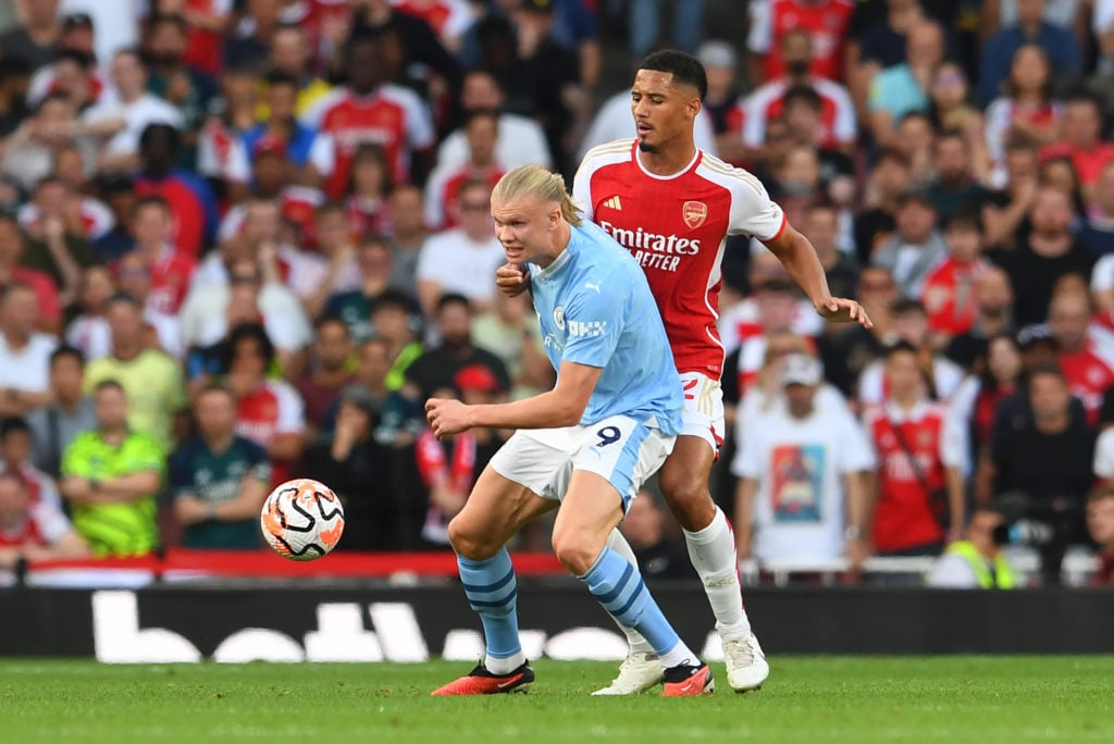 Arsenal defender William Saliba in action vs Manchester City striker Erling Haaland