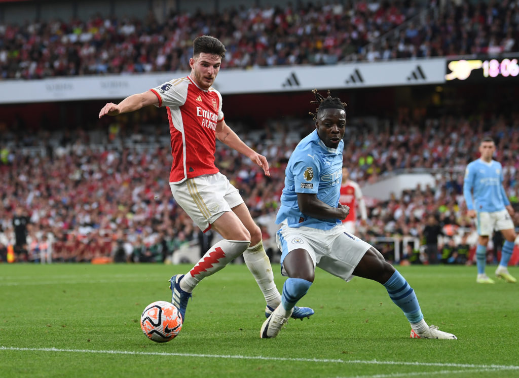 Arsenal midfielder Declan Rice in action v Joseph Doku of Manchester City in Premier League