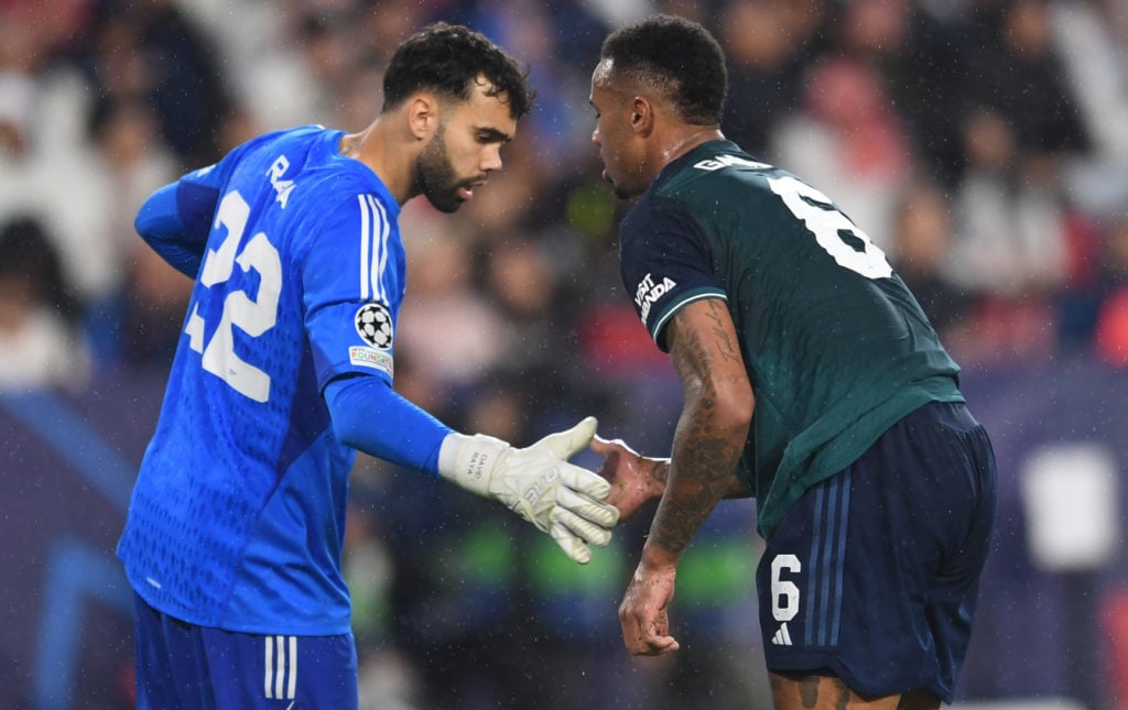 Arsenal goalkeeper David Raya and defender Gabriel Magalhaes in UEFA Champions League action vs Sevilla