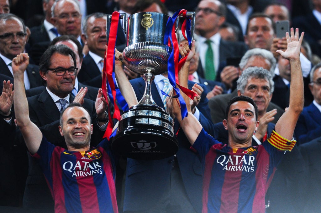 Barcelona legends Xavi and Iniesta lift Copa del Rey trophy after beating Athletic Bilbao