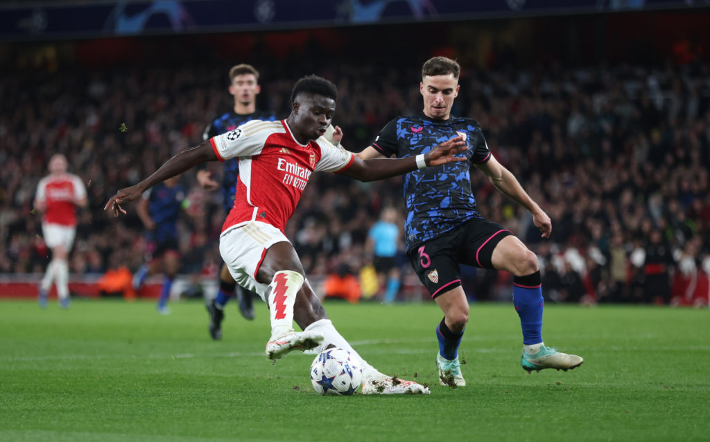 Arsenal winger Bukayo Saka scoring v Sevilla in Group B of UEFA Champions League 2023/24