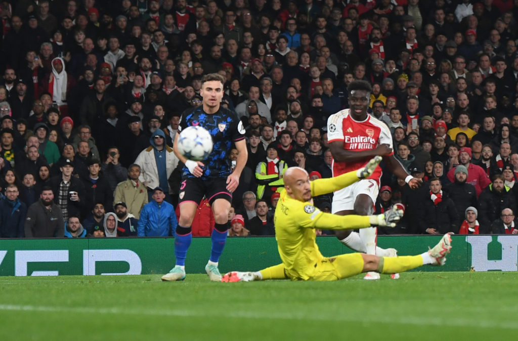 Arsenal winger Bukayo Saka scoring v Sevilla in Group B of UEFA Champions League 2023/24