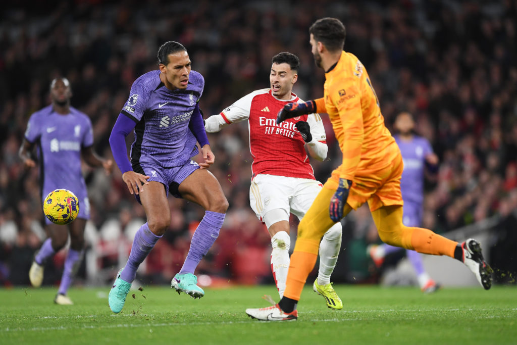 Arsenal forward Gabriel Martinelli in action v Liverpool defender Virgil van Dijk and goalkeeper Alisson Becker in Premier League