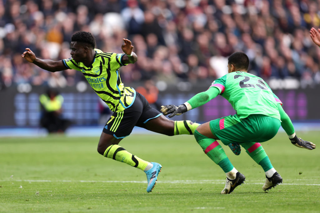 Arsenal winger Bukayo Saka in Premier League action vs West Ham United when fouled by Alphonse Areola