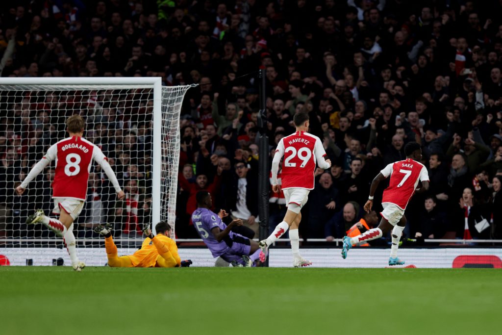 Arsenal winger Bukayo Saka celebrates scoring vs Premier League title rival Liverpool