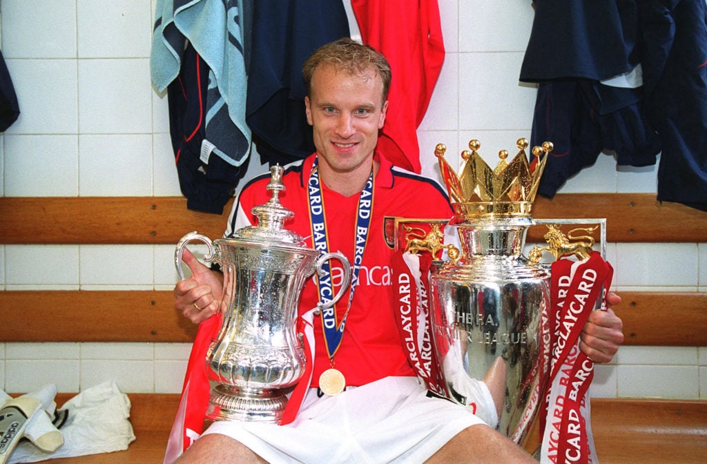 Arsenal legend Dennis Bergkamp with 2001/02 Premier League trophy