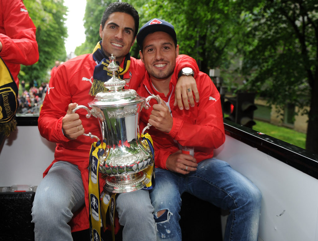 Mikel Arteta and Santi Cazorla of Arsenal parade 2015 FA Cup