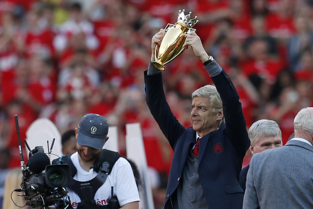 Arsenal legend Arsene Wenger with golden 2003/04 Invincibles unbeaten Premier League trophy