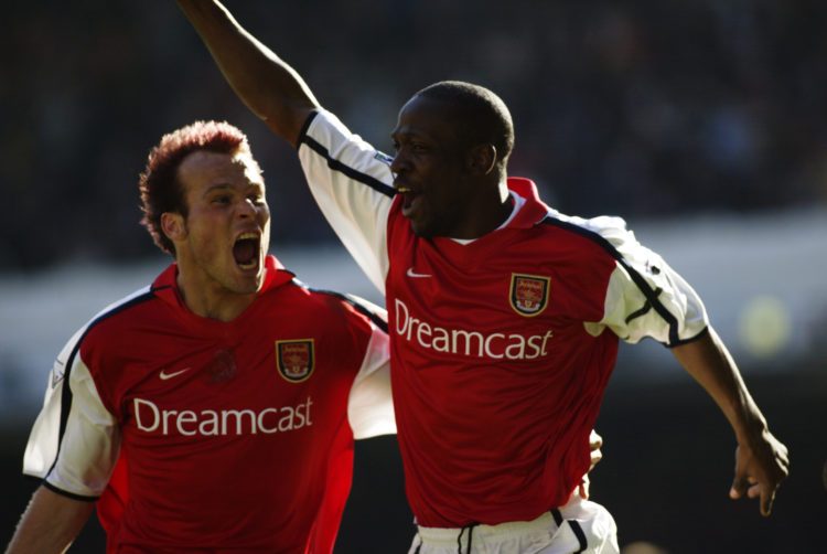 6 Apr 2002:  Lauren (right) of Arsenal celebrates scoring the winning goal from the penalty spot with team-mate Fredrik Ljungberg (left) during the...