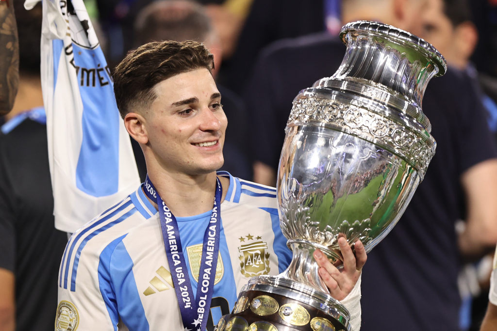 Julian Alvarez holds the Copa America trophy after winning it with Argentina