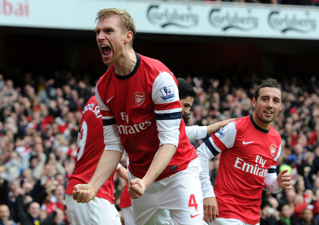 Per Mertesacker celebrates scoring during Arsenal v Tottenham Hotspur in the Premier League clash.