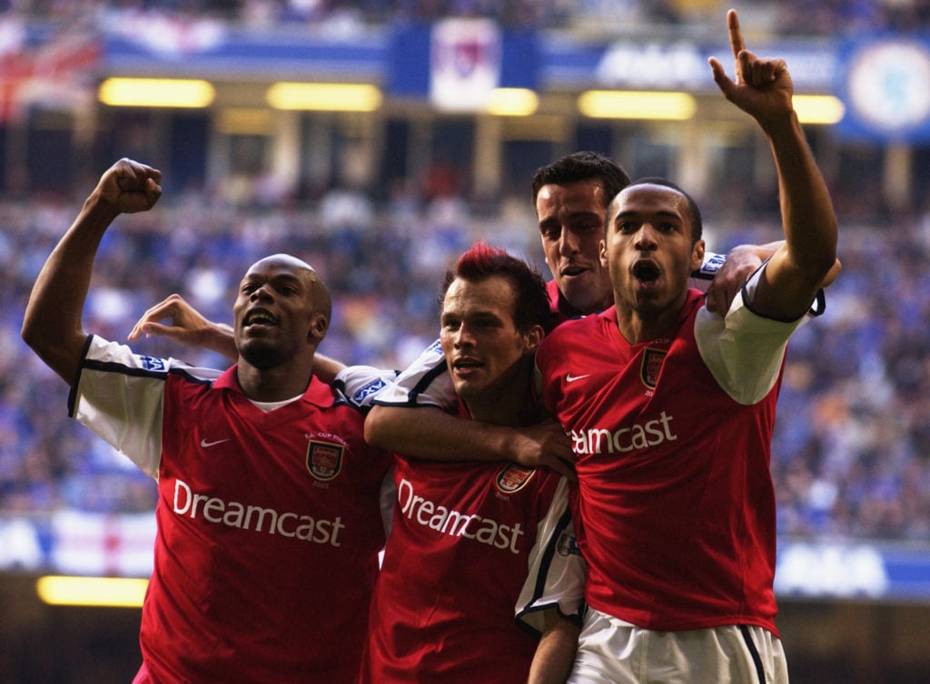 Sylvain Wiltord, Fredrik Ljungberg, Edu and Thierry Henry of Arsenal celebrate