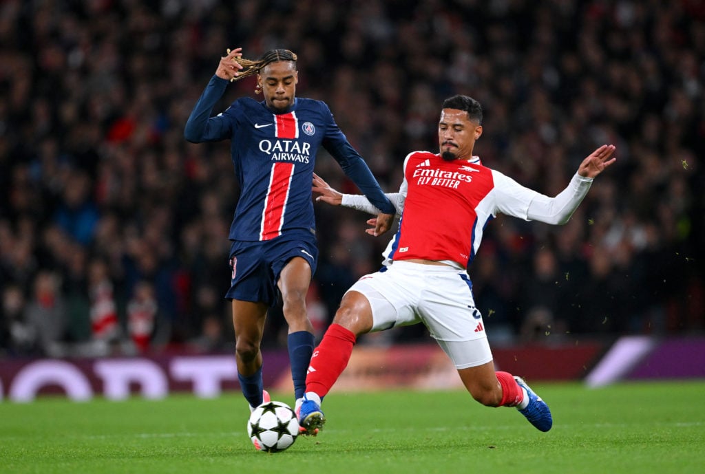 Bradley Barcola of Paris Saint-Germain is challenged by William Saliba of Arsenal during the UEFA Champions League.