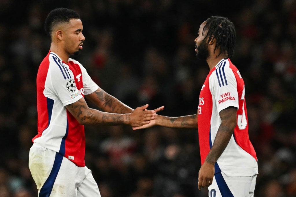 Gabriel Jesus shaking hands with Raheem Sterling during a substitution in an Arsenal game