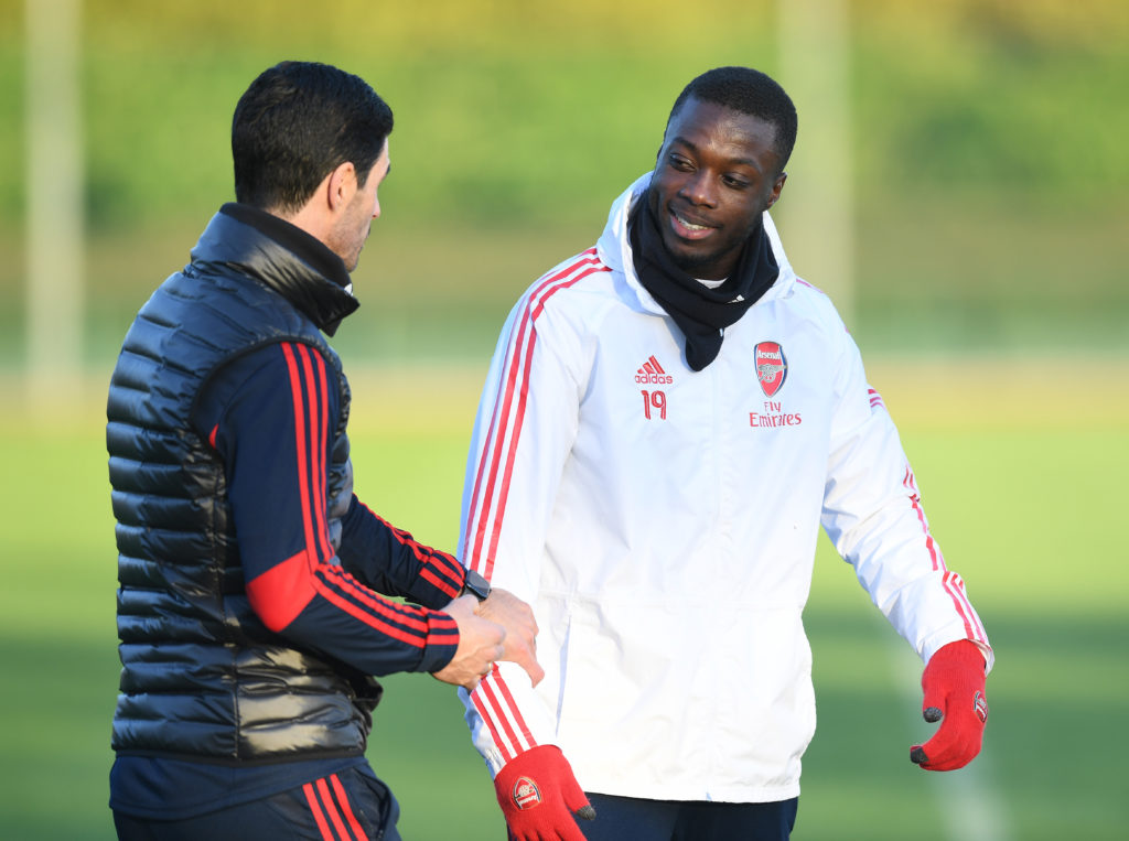 Nicolas Pepe and Mikel Arteta speaking to each other during an Arsenal training session