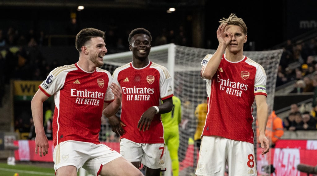 Declan Rice, Bukayo Saka and Martin Odegaard celebrate during an Arsenal game