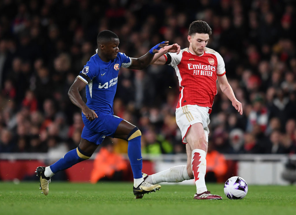 Moises Caicedo challenges Declan Rice during Arsenal vs Chelsea