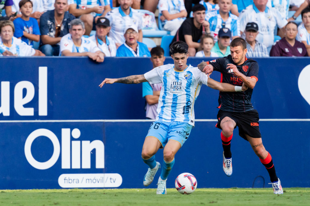 Antonio Cordero (L), of Malaga CF and Oscar Sielva (R), of