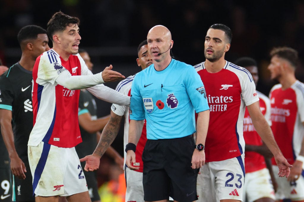 Kai Havertz argues with referee Anthony Taylor as Mikel Merino looks on during an Arsenal game