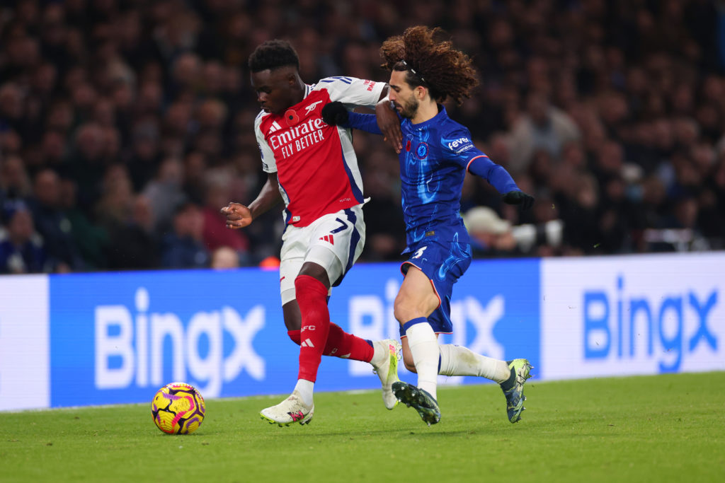 Bukayo Saka and Marc Cucurella in action during a game between Arsenal and Chelsea