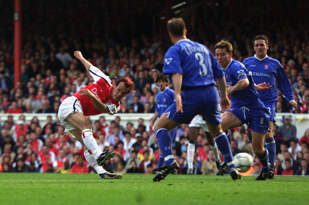 Fredrik Ljungberg of Arsenal striking the ball, which leads to Arsenal's first goal