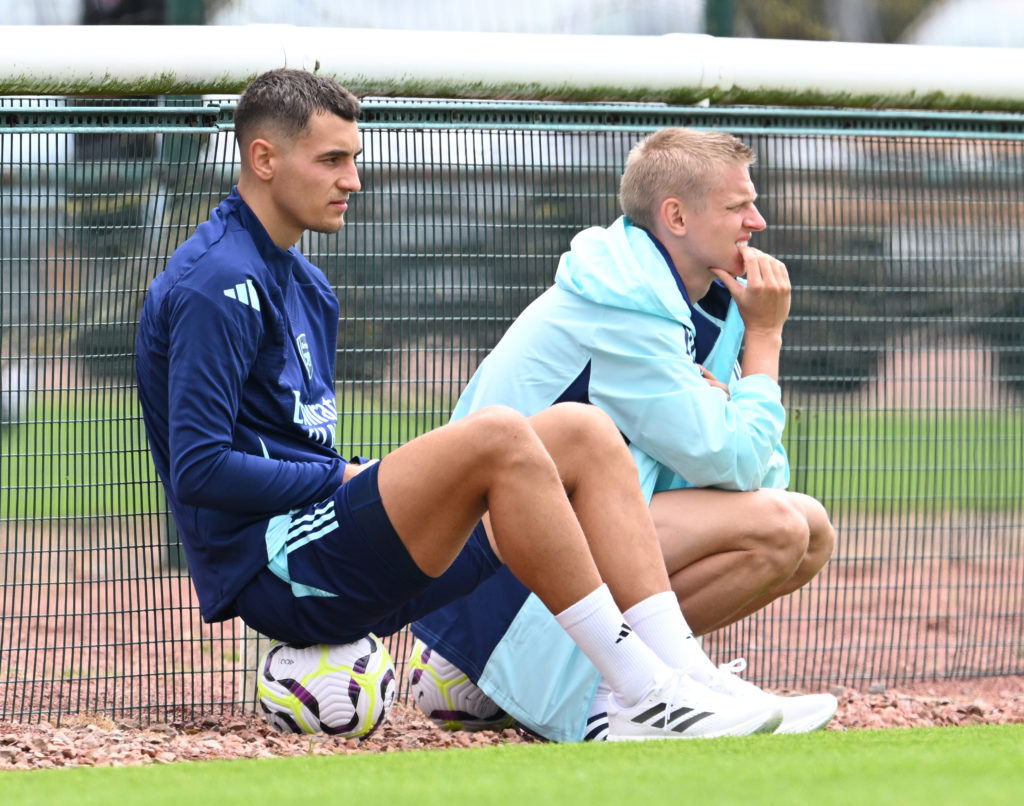 Jakub Kiwior and Oleksandr Zinchenko watching during an Arsenal pre-season friendly