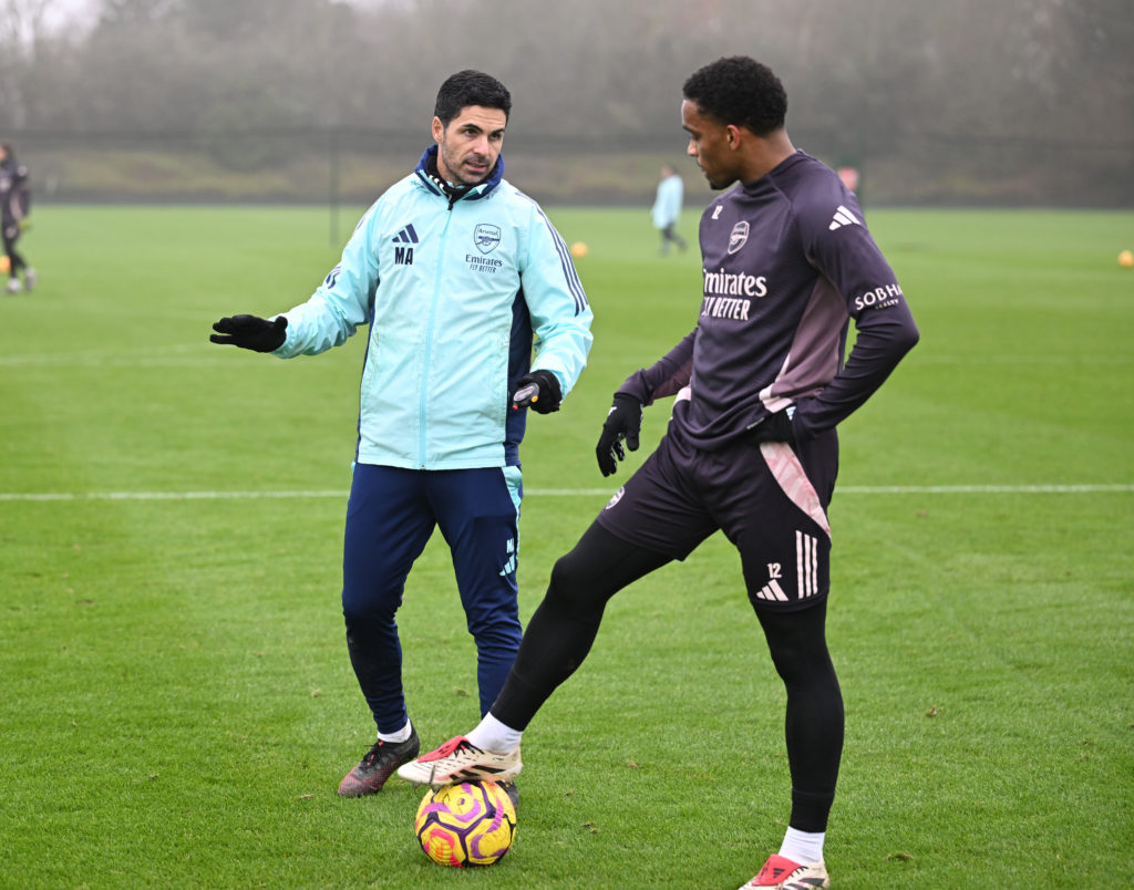 Mikel Arteta speaks to Jurrien Timber during an Arsenal Training Session