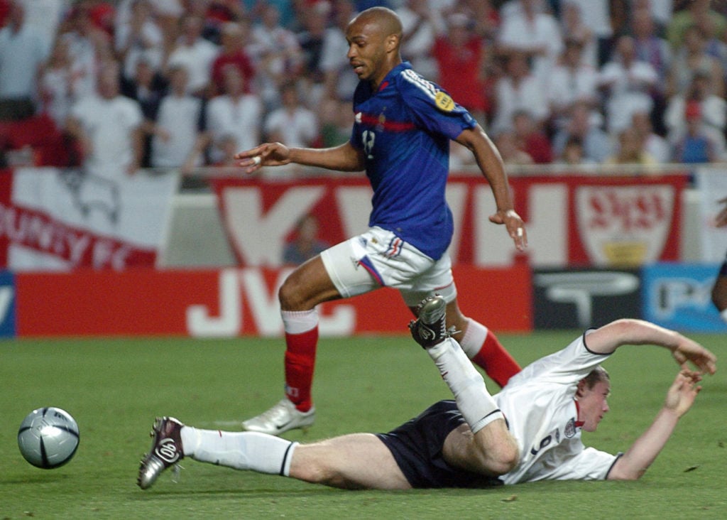 French forward Thierry Henry (top) dribb