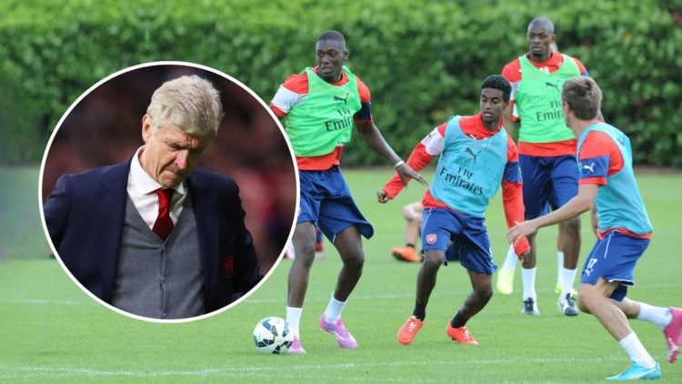 Arsene Wenger looks disappointed inset over Yaya Sanogo and Gedion Zelalem of Arsenal during a training session