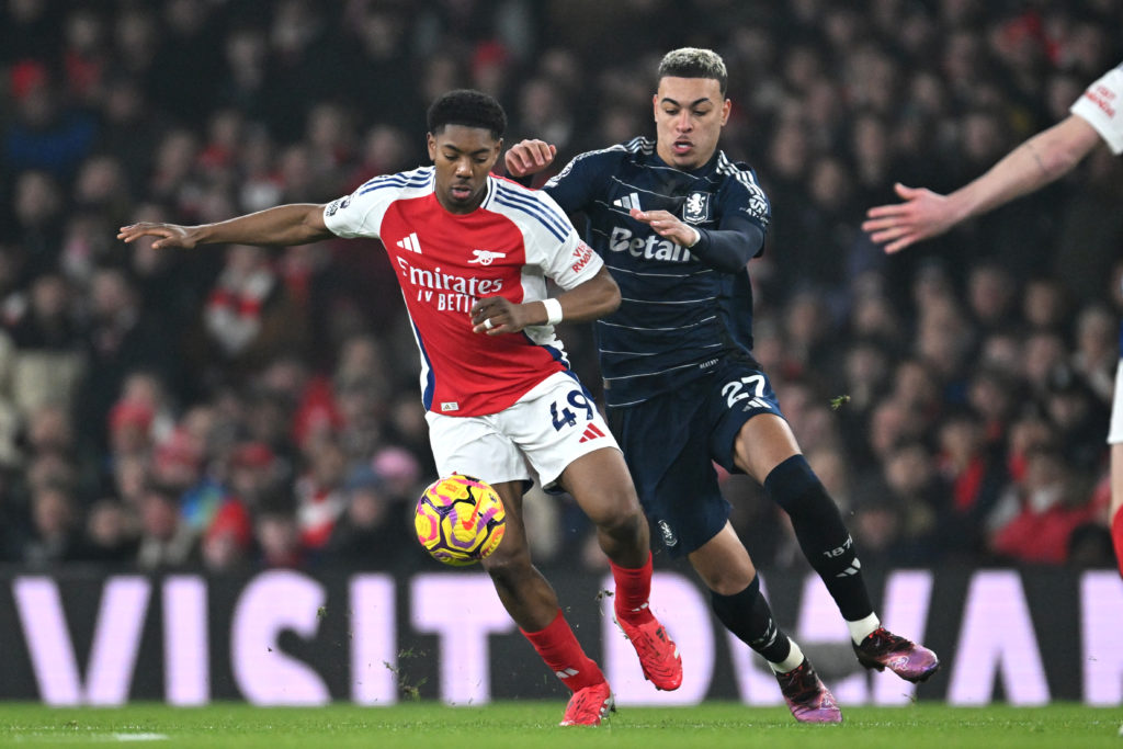 Myles Lewis-Skelly of Arsenal is challenged by Morgan Rogers of Aston Villa during the Premier League match between Arsenal FC and Aston Villa FC at Emirates Stadium on January 18, 2025