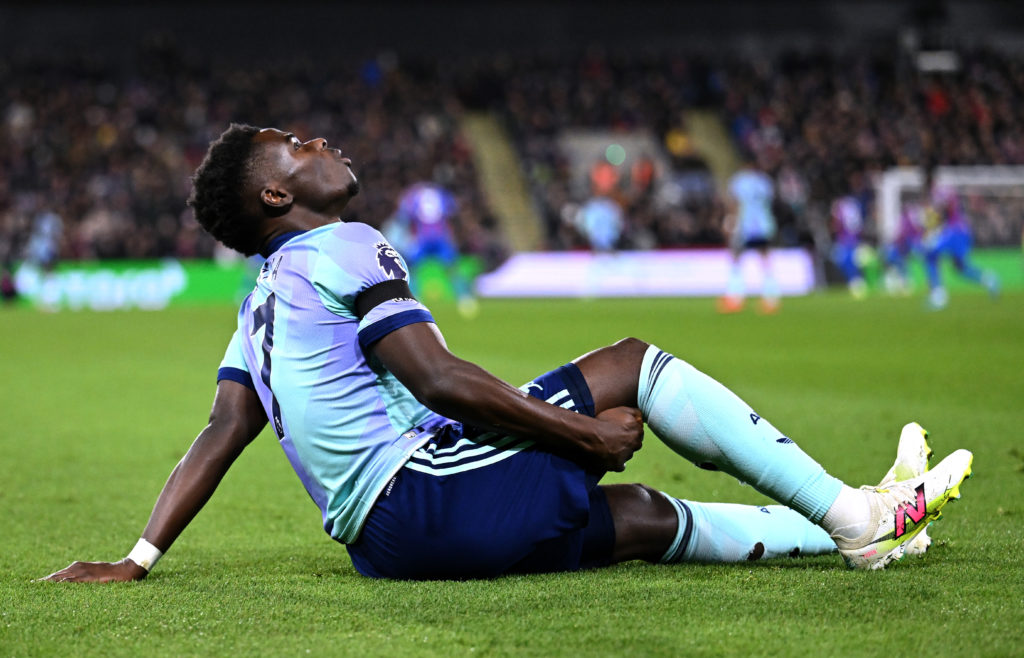 Bukayo Saka down injured during Crystal Palace FC v Arsenal FC in the Premier League clash.