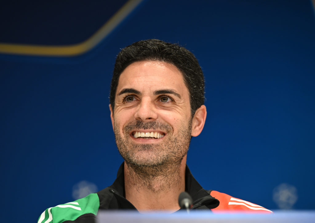 Mikel Arteta smiling during an Arsenal pre-match press conference