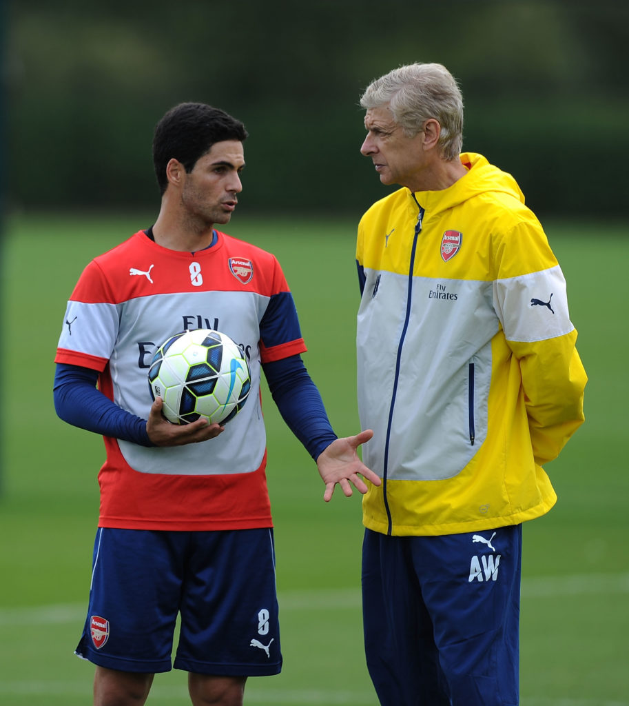 Mikel Arteta and Arsene Wenger in conversation during an Arsenal Training Session
