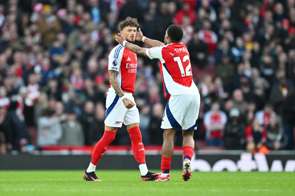 Jurrien Timber embraces Ben White during an Arsenal game