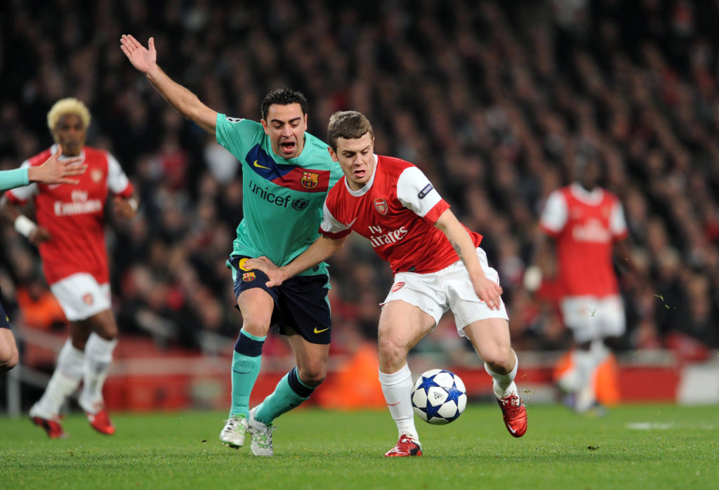Jack Wilshere dribbles past Xavi Hernandez during Arsenal's 2-1 win against Barcelona in the Champions League in 2011.