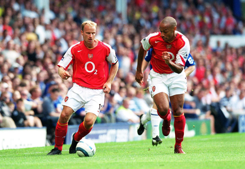 NGLAND - AUGUST 15: Dennis Bergkamp and Thierry Henry of Arsenal during the Premier League match between Everton and Arsenal on August 15, 2004 in Liverpool, England.