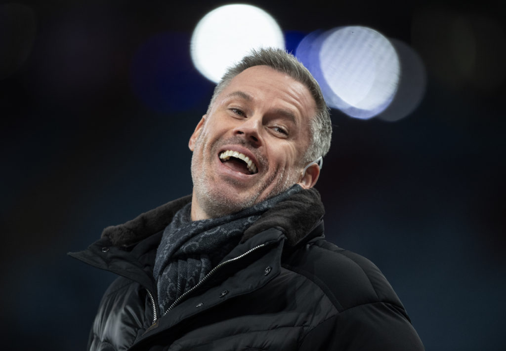 Jamie Carragher laughing while working as a pundit