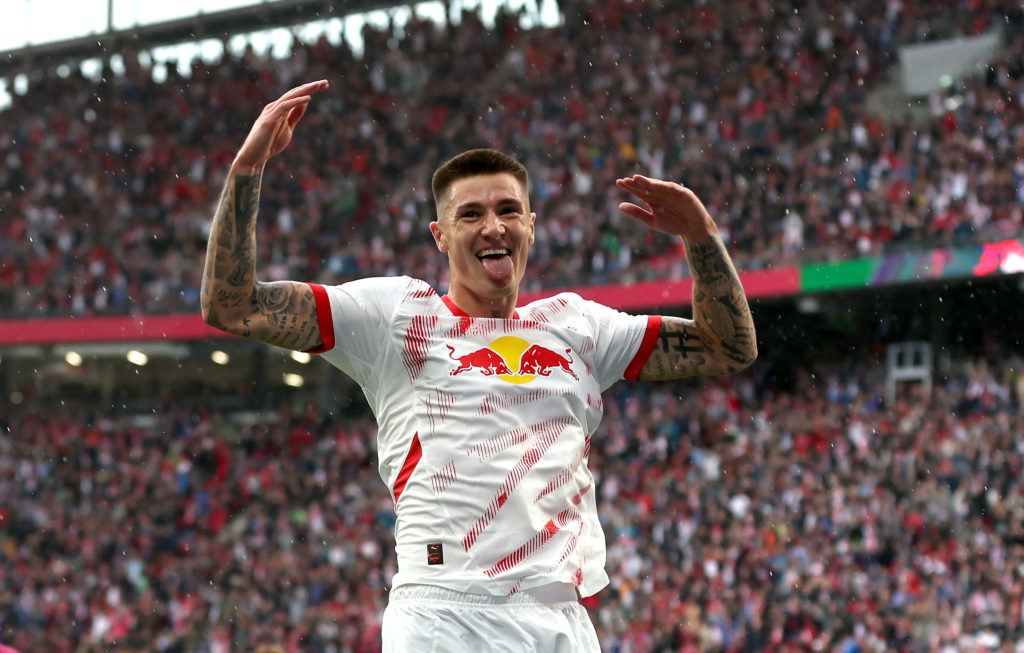Benjamin Sesko celebrates during RB Leipzig v FC Augsburg in the Bundesliga clash.