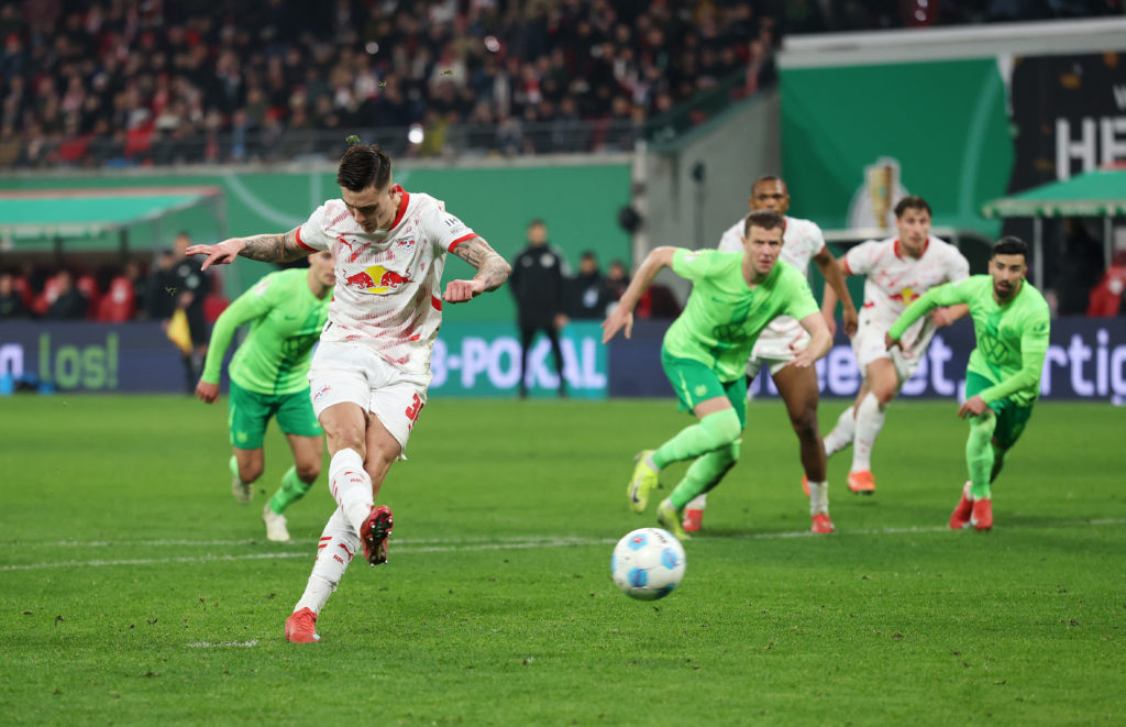 Benjamin Sesko scores during RB Leipzig v VfL Wolfsburg in the DFB Cup quarter-final clash.