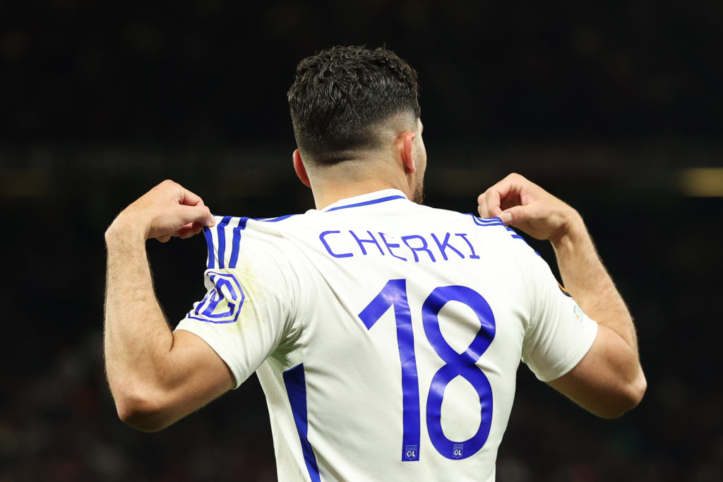 Rayan Cherki celebrates scoring for Lyon against Manchester United.