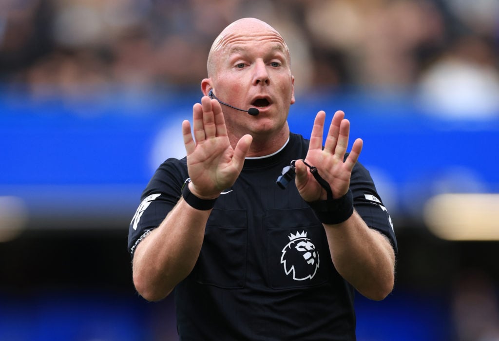 Simon Hooper gestures during a Premier League match