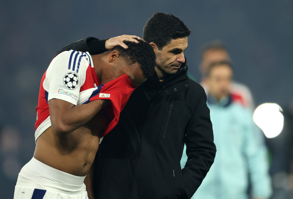 Mikel Arteta consoles Jurrien Timber after defeat in the Paris Saint-Germain v Arsenal FC UEFA Champions League 2024/25 Semi Final Second Leg clash.