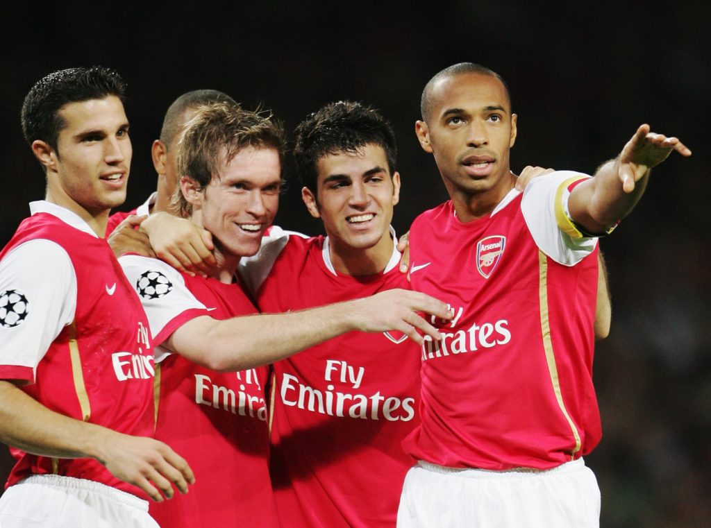 Arsenal players including Cesc Fabregas celebrate a goal
