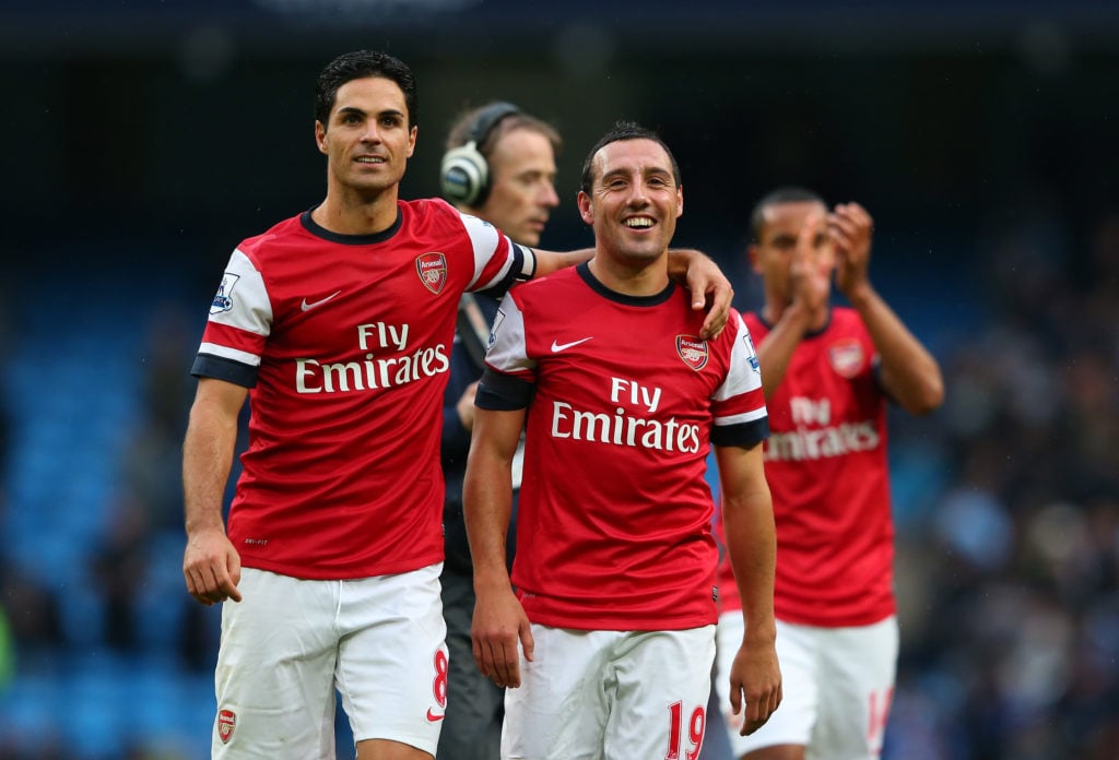 Mikel Arteta embraces Santi Cazorla after Manchester City v Arsenal in the Premier League clash in 2012.