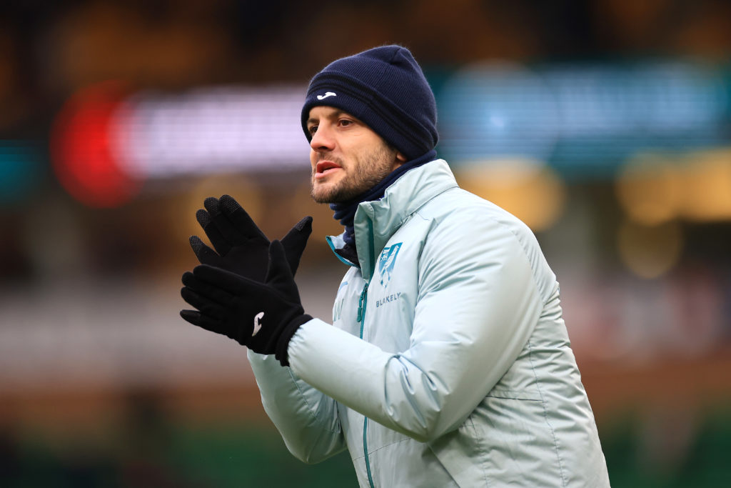 Jack Wilshere applauding from the touchline during a Norwich City game